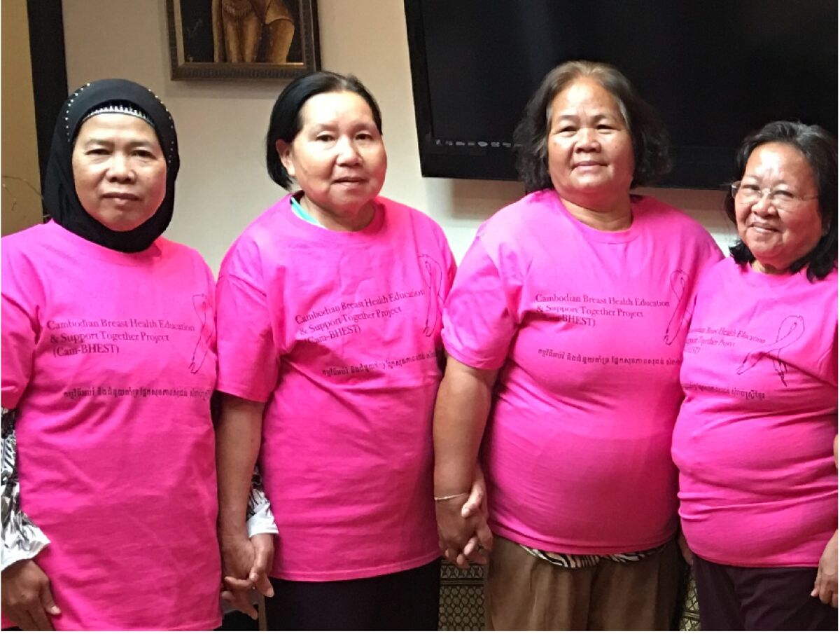 Four women wear Cambodian Family t-shirts.