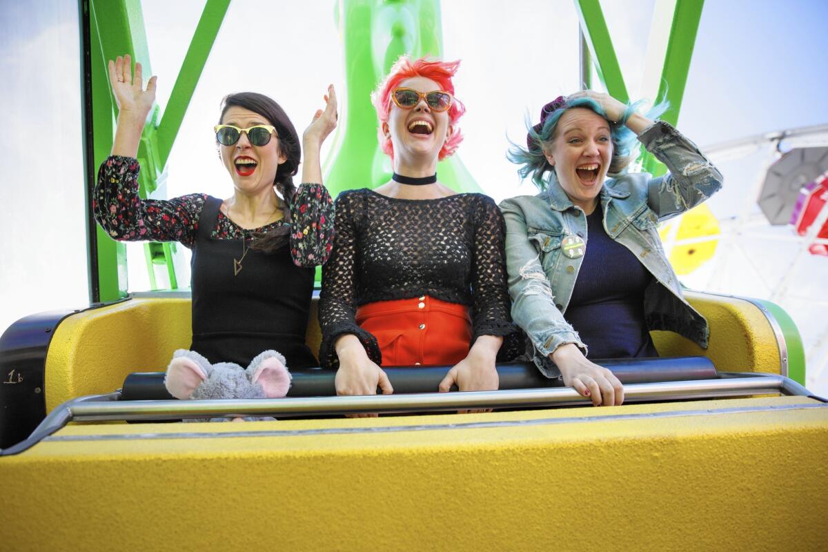 The musicians of Bleached, Micayla Grace, left, Jennifer Clavin and Jessie Clavin, during a trip to the Santa Monica Pier