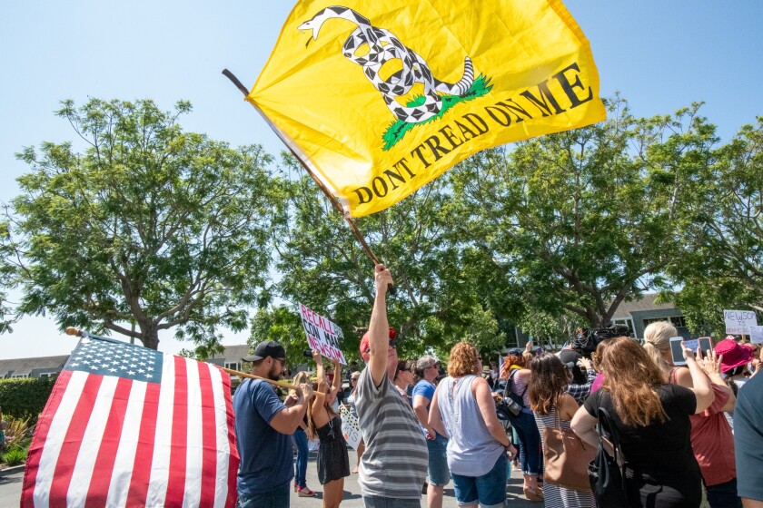 A protester at a news conference in Costa Mesa