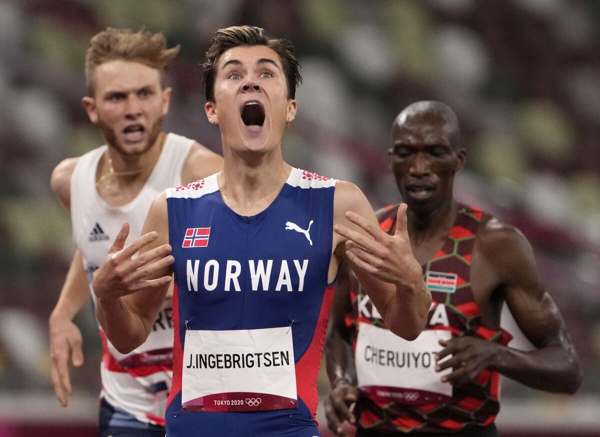 Jakob Ingebrigtsen of Norway celebrates immediately after winning the gold medal in the men's 1,500 meters.