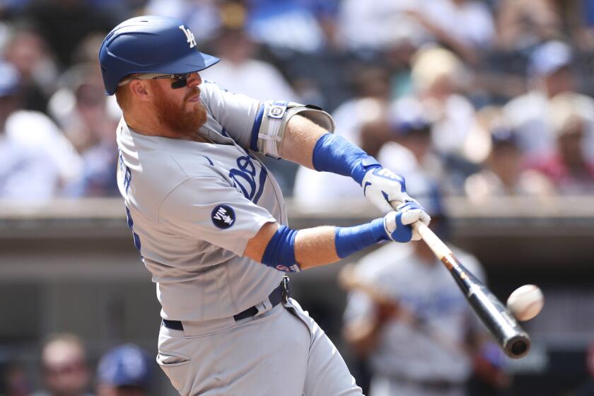Los Angeles Dodgers' Justin Turner hits a solo home run off San Diego Padres' Joe Musgrove.