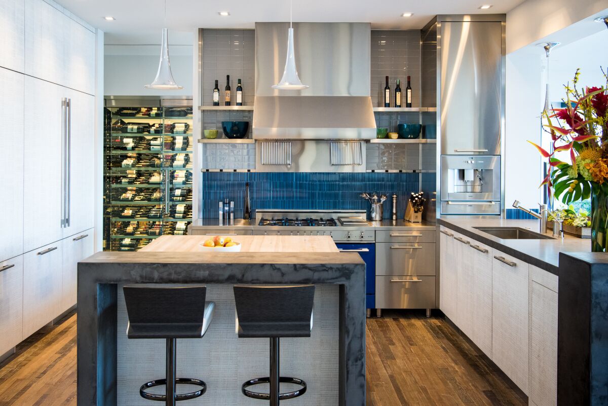 Today, he loves to entertain, which is no surprise, given that his kitchen looks like this. That gorgeous wine rack? It used to be the closet that was tucked underneath the staircase.