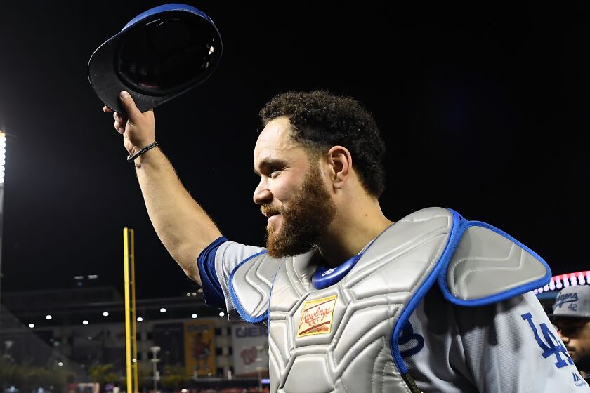 WASHINGTON D.C., OCTOBER 4, 2019-Dodgers catcher Russell Martin ackowledges the Dodger fans after defeating the Nationals 10-4 in Game 3 of the NLDS at Nationals Stadium Sunday. (Wally Skalij/Los Angeles Times)