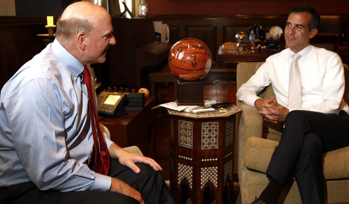 Steve Ballmer, left, talks with Mayor Eric Garcetti at Los Angeles City Hall on Friday afternoon about his pending purchase of the Clippers.