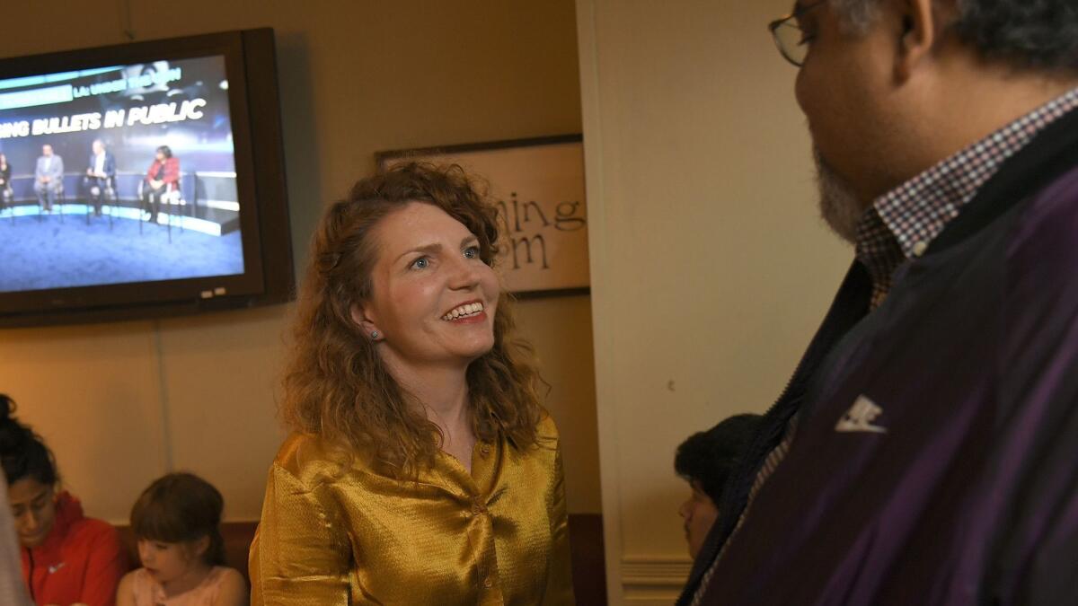 Heather Repenning talks with union leader Max Arias during an election night party at a restaurant in Eagle Rock.