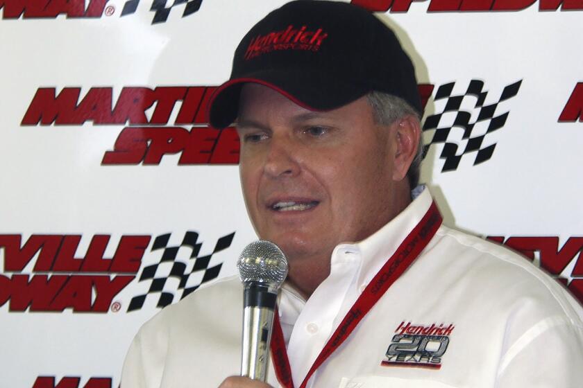 FILE - Rick Hendrick, owner of Hendrick Motorsports, speaks to the press at Martinsville Speedway, Sunday April 18, 2004, in Martinsville, Va. Hendrick was at church 20 years ago when Geoffrey Bodine drove an unsponsored car to victory at Martinsville Speedway, giving Rick Hendrick his first victory as an owner. (AP Photo/Steve Helber)