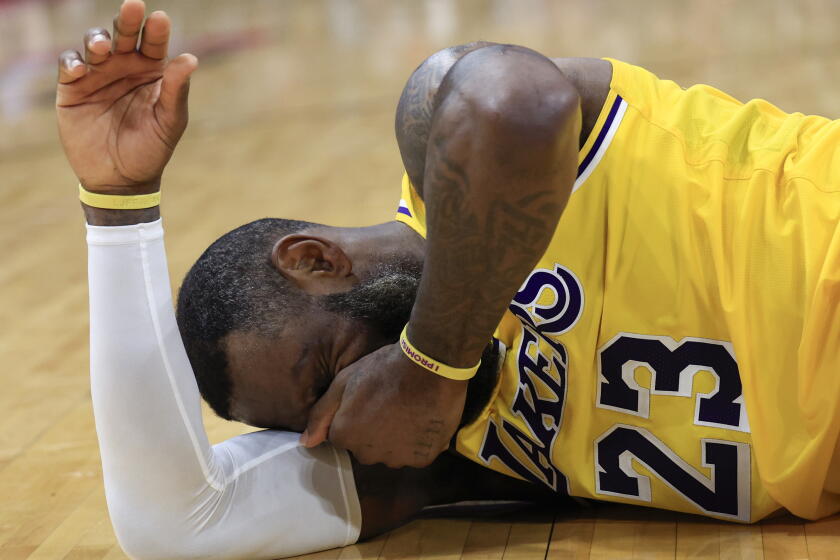 HOUSTON, TEXAS - JANUARY 29: LeBron James #23 of the Los Angeles Lakers is fouled on a play during the second half against the Houston Rockets at Toyota Center on January 29, 2024 in Houston, Texas. NOTE TO USER: User expressly acknowledges and agrees that, by downloading and or using this photograph, User is consenting to the terms and conditions of the Getty Images License Agreement. (Photo by Carmen Mandato/Getty Images)