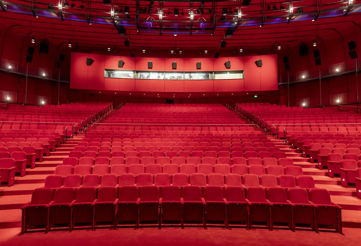 Scarlet red seats in David Geffen Theater at the new Academy Museum of Motion Pictures. 