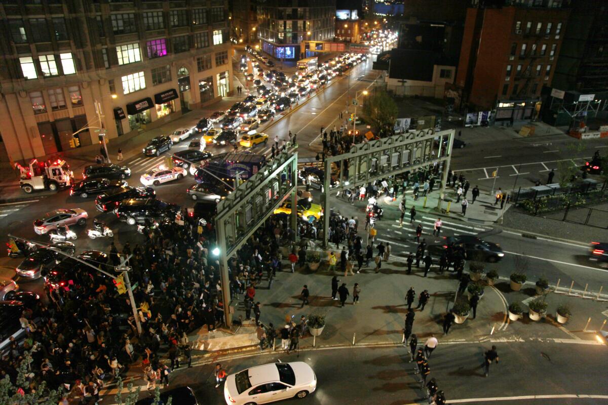 Demonstrators snarl traffic in New York City on Wednesday as they try to block an entrance to the Holland Tunnel.