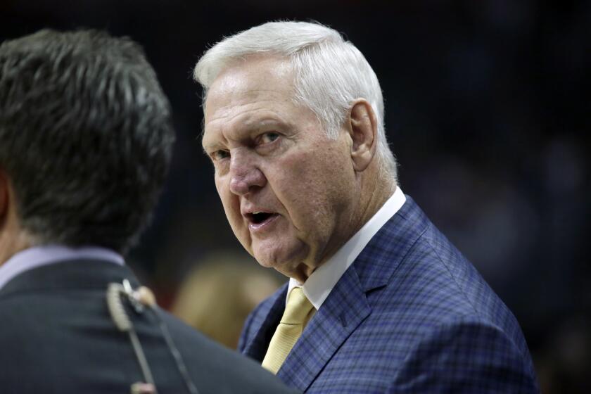 Jerry West talks prior to an NBA basketball game between the Los Angeles Clippers and the Minnesota Timberwolves.