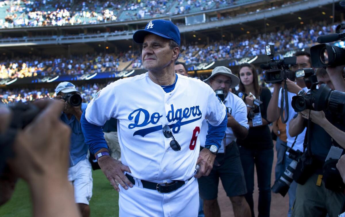 Joe Torre takes it all in after his last home game as Dodgers manager, in 2010.