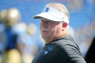 Pasadena, CA - UCLA Bruins head coach Chip Kelly watches his team warm up before a Pac-12 Conference game against the Washington State Cougars at the Rose Bowl in Pasadena on Saturday, Oct. 7, 2023. Bruins won, 25 -17. (Luis Sinco / Los Angeles Times)