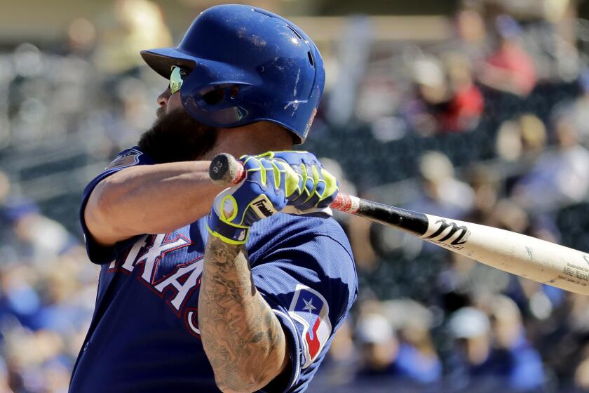 Texas Rangers' Mike Napoli bats during the first inning of a spring training baseball game against the Kansas City Royals Saturday, Feb. 25, 2017, in Surprise, Ariz. (AP Photo/Charlie Riedel)