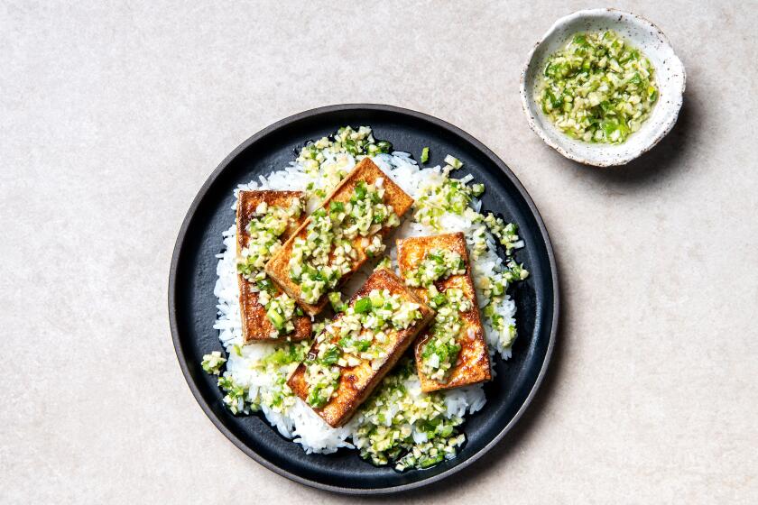 LOS ANGELES, CA-August 29, 2019: Sizzling Ginger Scallion Sauce with Fried Tofu on Thursday, August 29, 2019. (Mariah Tauger / Los Angeles Times / prop styling by Nidia Cueva )
