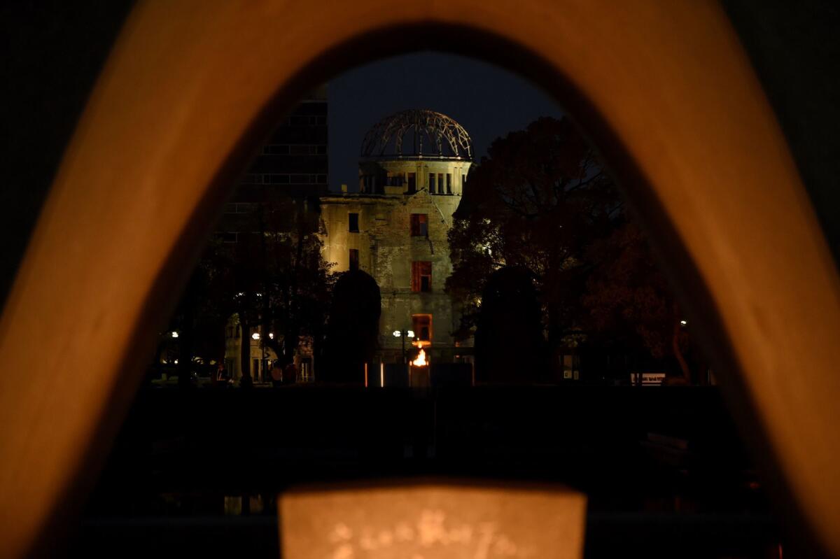 The atomic bomb dome is seen through the altar of Hiroshima Peace Memorial Park.