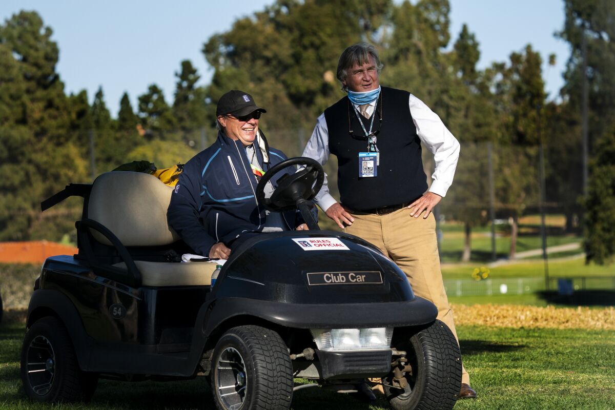 PGA Tour rules consultant Mark Russell, right, chats with rules official John Mutch at the Genesis Invitational.