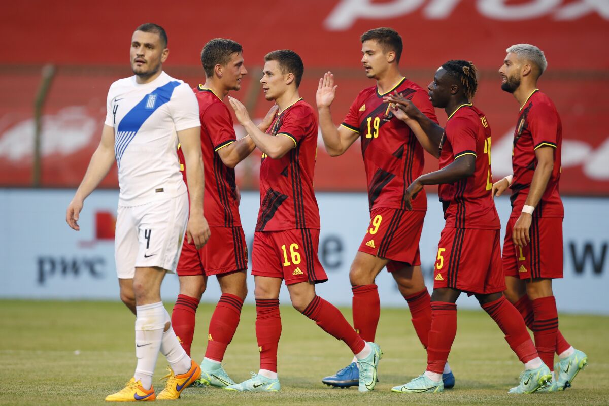 Belgium's Thorgan Hazard, third left, is congratulated after scoring the opening goal of the match during the international friendly soccer match between Belgium and Greece at the King Baudouin stadium in Brussels, Thursday, June 3, 2021. (AP Photo/Francisco Seco)