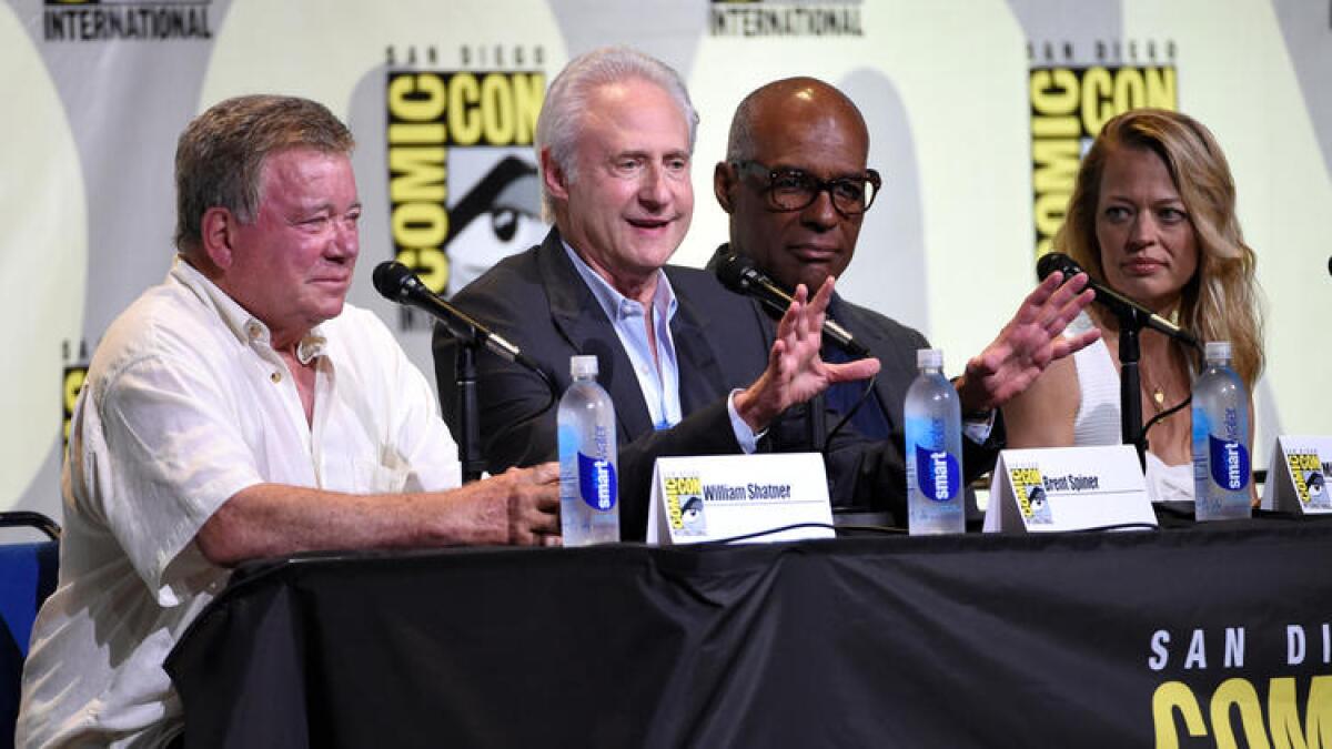 William Shatner, from left, Brent Spiner, Michael Dorn and Jeri Ryan attend the "Star Trek" panel on day 3 of Comic-Con International on July 23 in San Diego.