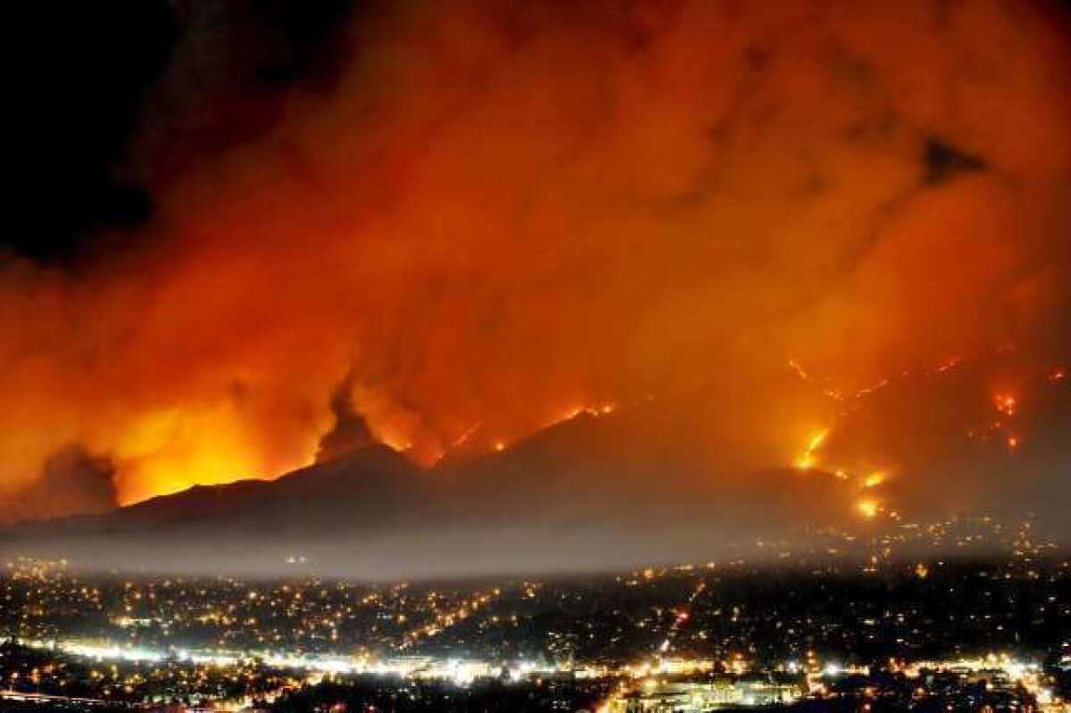 The Station fire burned 160,000 acres of the Angeles National Forest and set off a tense debate over whether the U.S. Forest Service should use night flights to battle blazes. On Thursday, Aug. 16, 2012, the agency agreed to restart night flights decades after abandoning them for safety reasons.