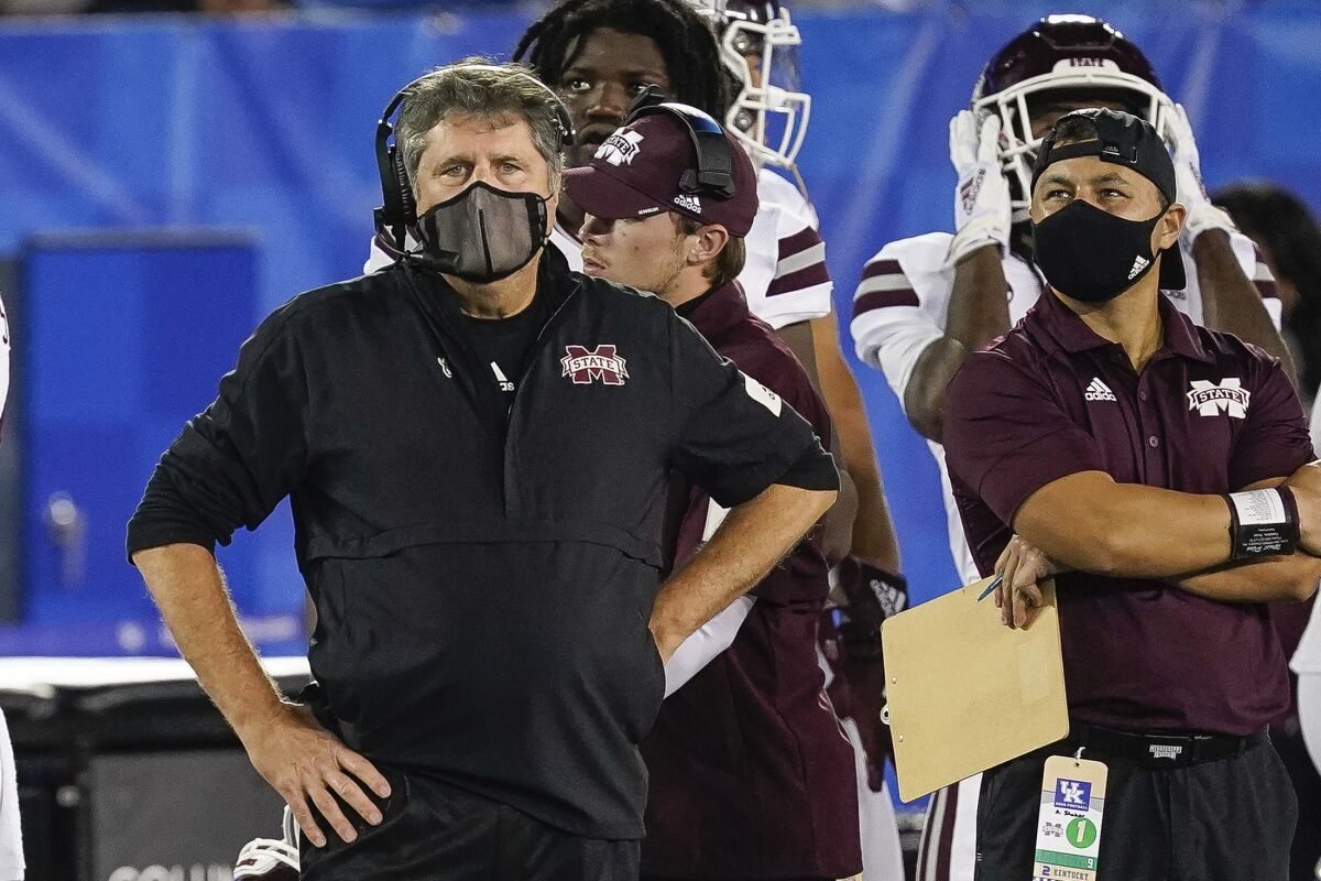 FILE- In this Saturday, Oct. 10, 2020, file photo, Mississippi State coach Mike Leach stands on the sideline during the second half of the team's NCAA college football game against Kentucky in Lexington, Ky. Mississippi State has managed a single victory, over winless Vanderbilt, in its last five games, averaging a mere 7.5 points in the losses. They face Georgia on Saturday night in Athens, Ga. (AP Photo/Bryan Woolston, File)