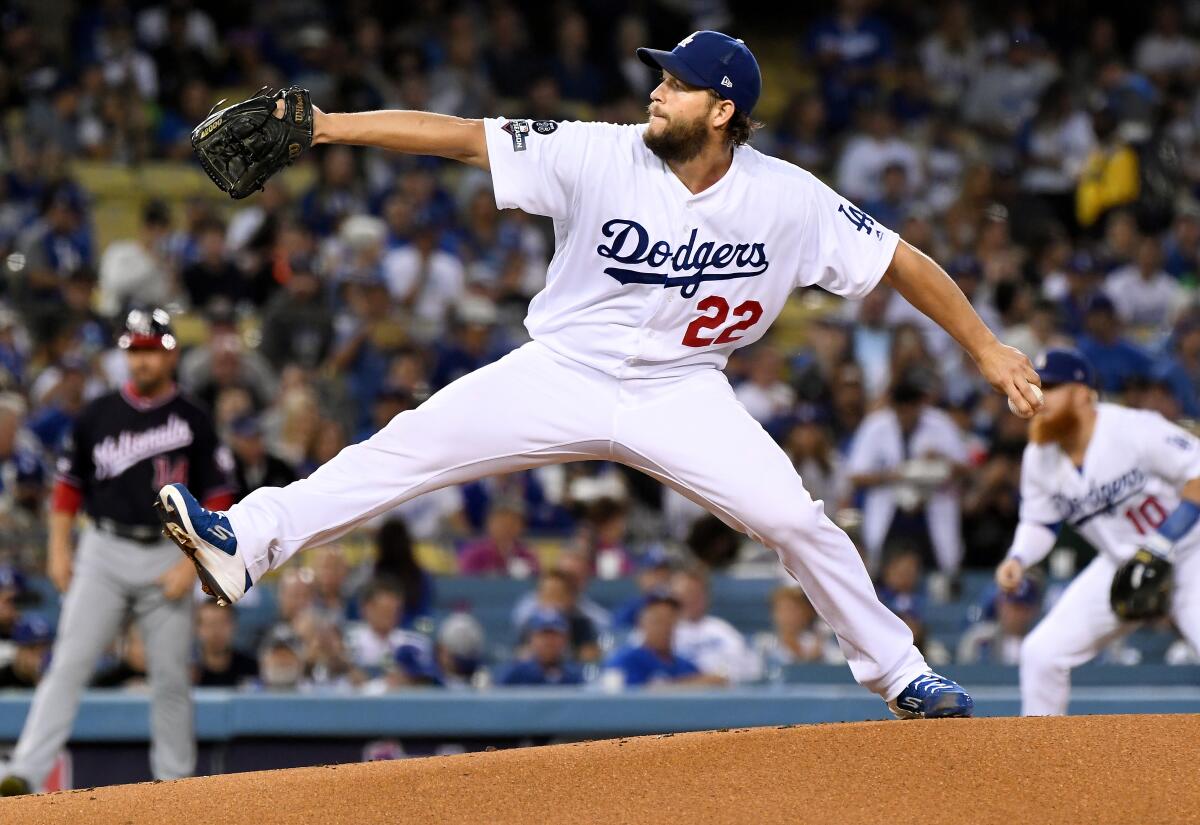 Dodgers pitcher Clayton Kershaw throws a pitch against the Washington Nationals in the first inning in Game 2 of the NLDS at Dodger Stadium on Oct. 4.