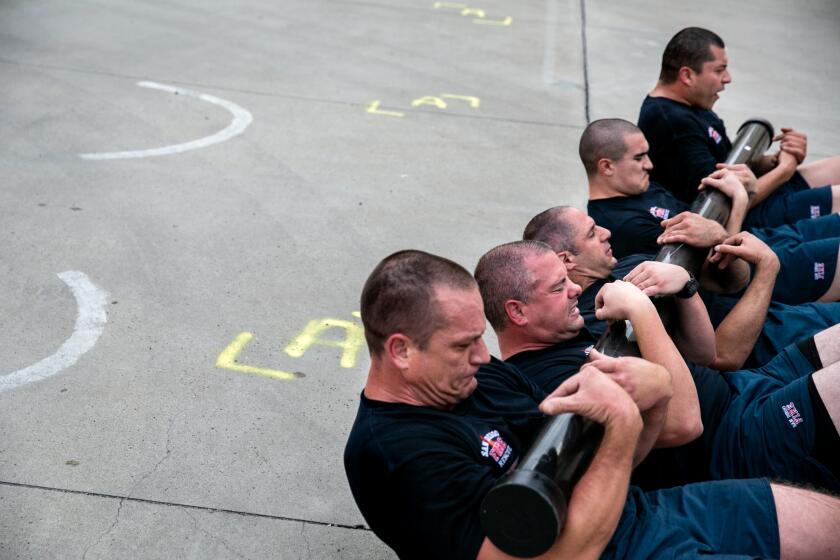 DO NOT PUBLISH WITHOUT SPEAKING TO PHOTO DEPARTMENT FIRST | Recruits take part in their "Code 9," a grueling morning exercise that jump starts their day at the San Diego Fire-Rescue Department's 87th Academy at the department's training facility on March 27, 2019 in San Diego, California.