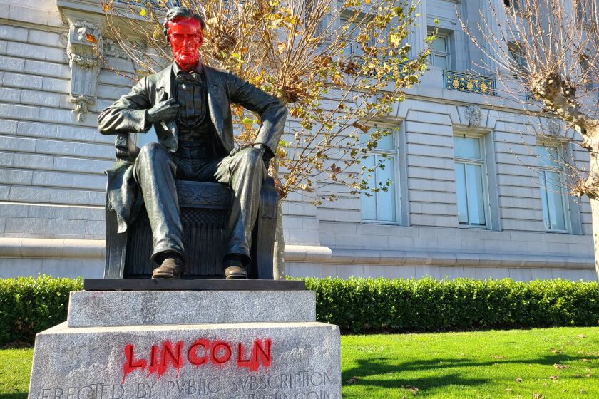 A statue of Abraham Lincoln was vandalized in front of San Francisco City Hall.