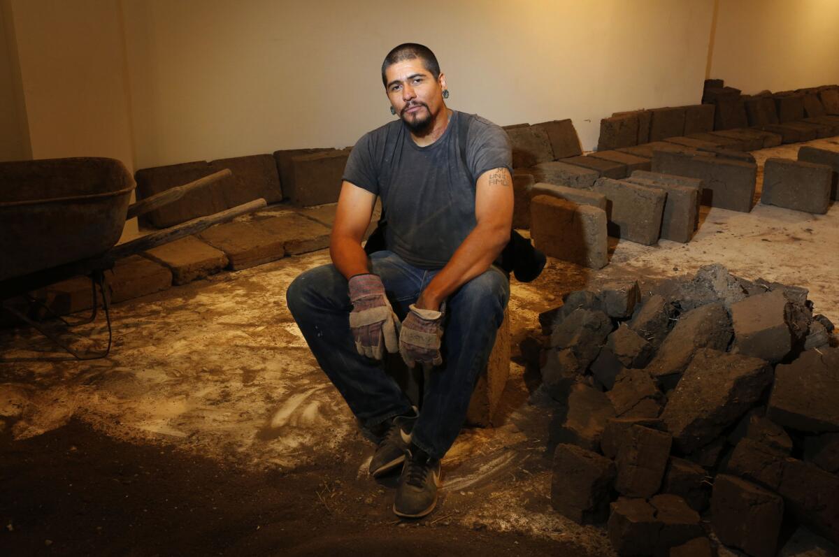 L.A. performance artist Rafa Esparza has crafted thousands of adobe bricks that he is using to build an elliptical structure inside the galleries of Los Angeles Contemporary Exhibitions (LACE) in Hollywood.