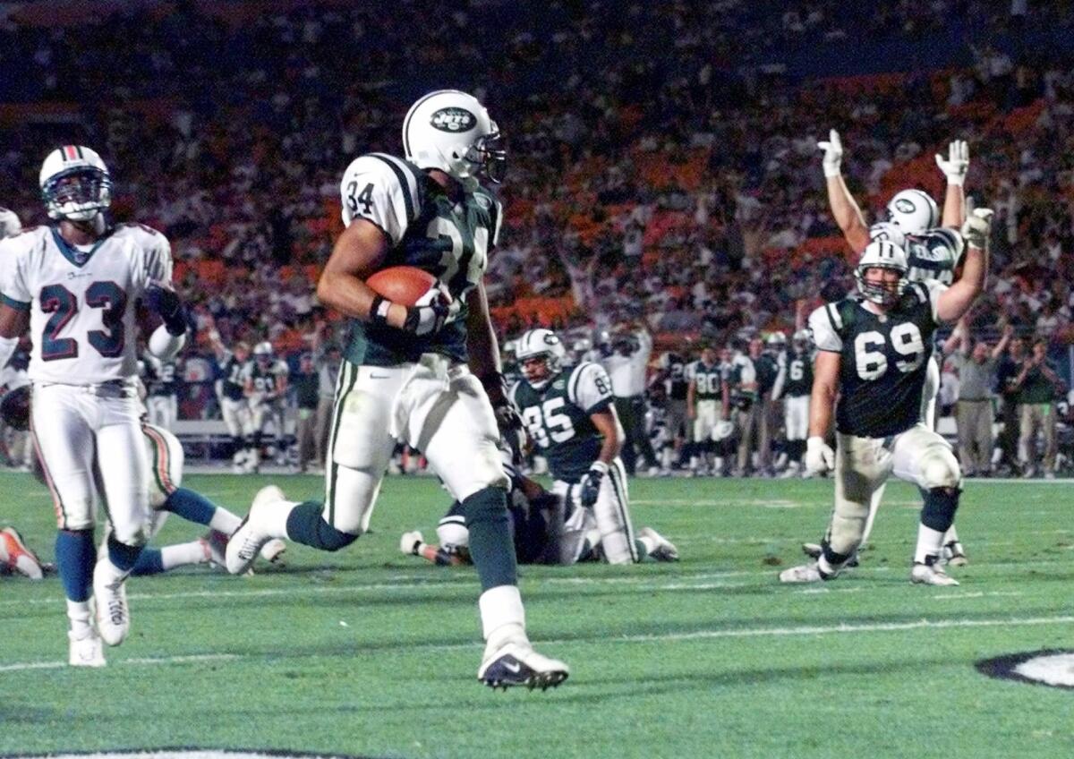 New York Jets running back Bernie Parmalee scores a touchdown.