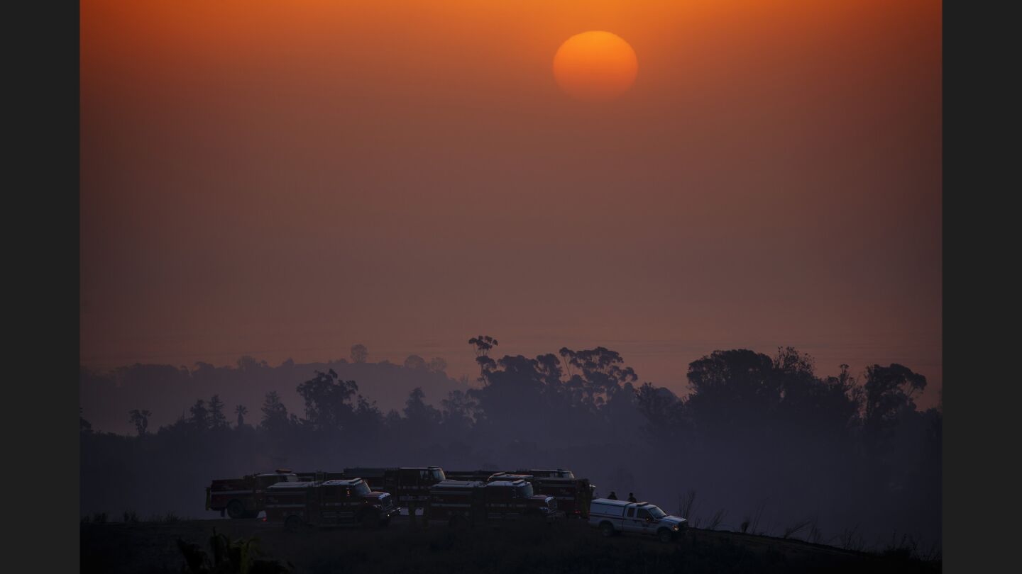 The sun rises as fire crews prepare for another day of fighting the Thomas Fire, in Montecito, Calif., on Sunday.
