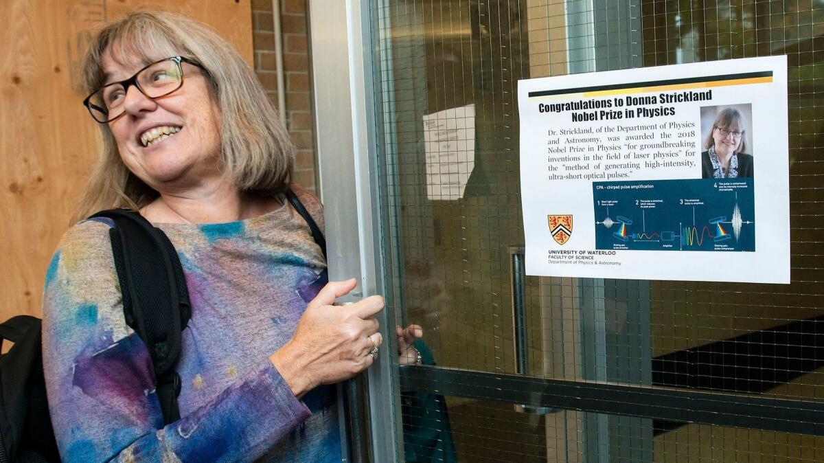 Donna Strickland, an associate physics professor at the University of Waterloo, enters the university's physics building after being awarded the 2018 Nobel Prize for Physics in Waterloo, Canada on Oct. 2.