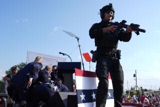 Republican presidential candidate former President Donald Trump is surrounded by U.S. Secret Service agents on stage at a campaign rally, Saturday, July 13, 2024, in Butler, Pa. (AP Photo/Evan Vucci)