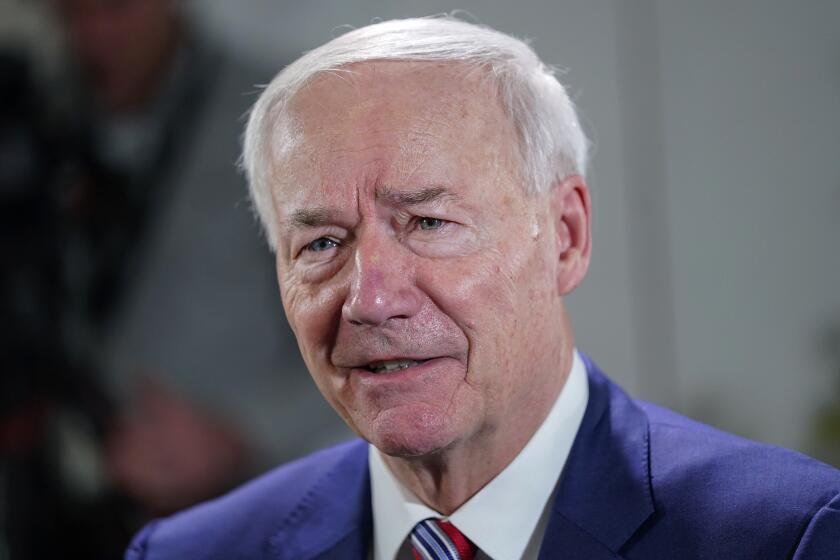 FILE - Arkansas Gov. Asa Hutchinson speaks during an interview with the Associated Press, Dec. 13, 2022 in Washington. Gov. Hutchinson says he’s running for president in 2024, offering himself as an alternative for Republicans ready to turn the party away from Donald Trump. The 72-year-old former governor joins a field that includes Trump, former United Nations Ambassador Nikki Haley and entrepreneur Vivek Ramaswamy.(AP Photo/Pablo Martinez Monsivais, File)