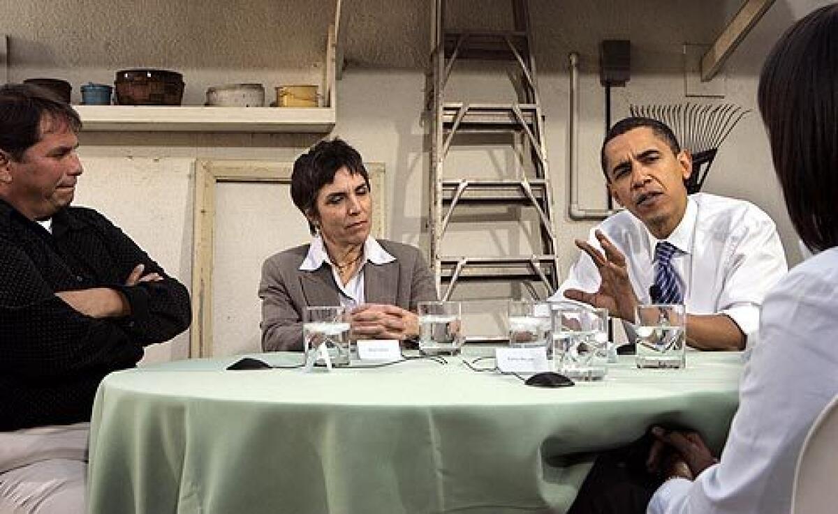 Democratic presidential candidate Barack Obama rolled up his sleeves and sat down for a discussion on economic opportunity in Van Nuys. Joining him were Gustavo Lizarde, left, Mimi Vitello and Kerry Bryant, back to the camera, at Vitello's home.