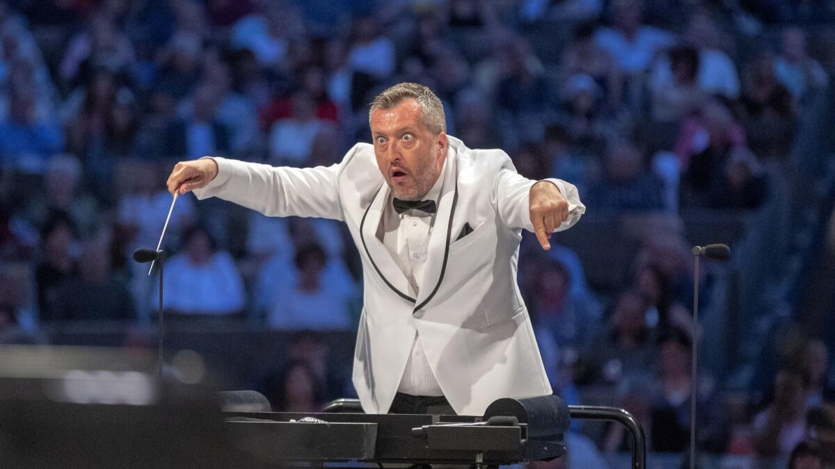 British composer Thomas Adès conducts the Los Angeles Philharmonic during his Hollywood Bowl debut Tuesday night.