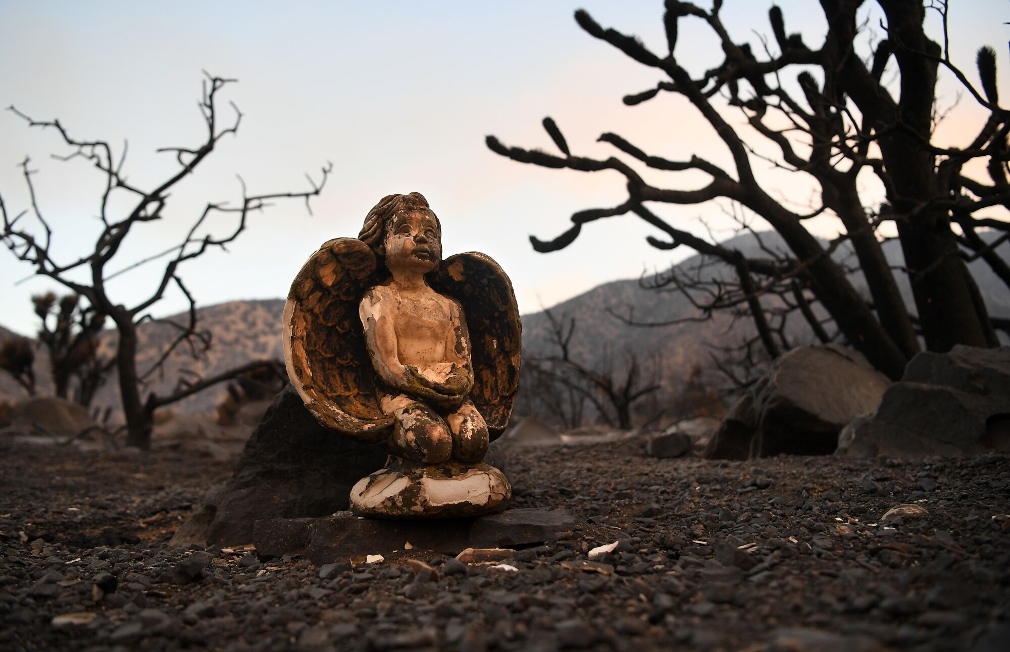 A burned statue of a baby angel in Juniper Hills on Saturday, Sept. 19.