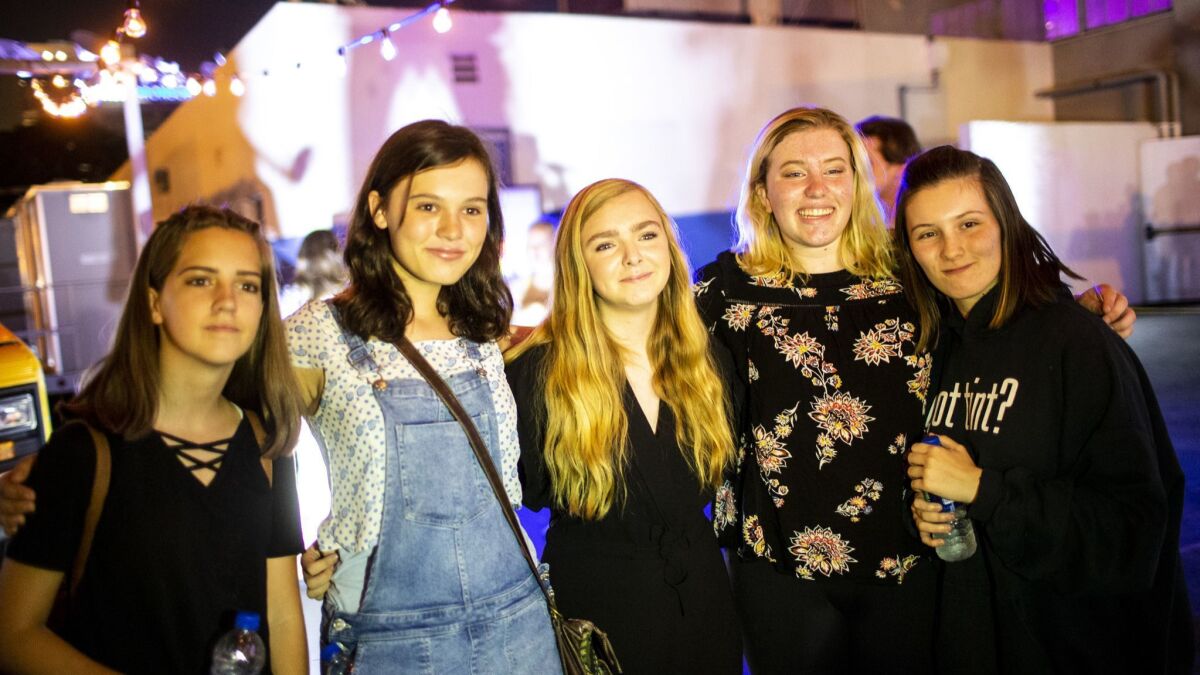 Kaylee Leffler, Emily Cliborn, Elizabeth Heuer and Leila Corran, pose for a picture with actress Elsie Fisher, the star of "Eighth Grade," at the after-party.