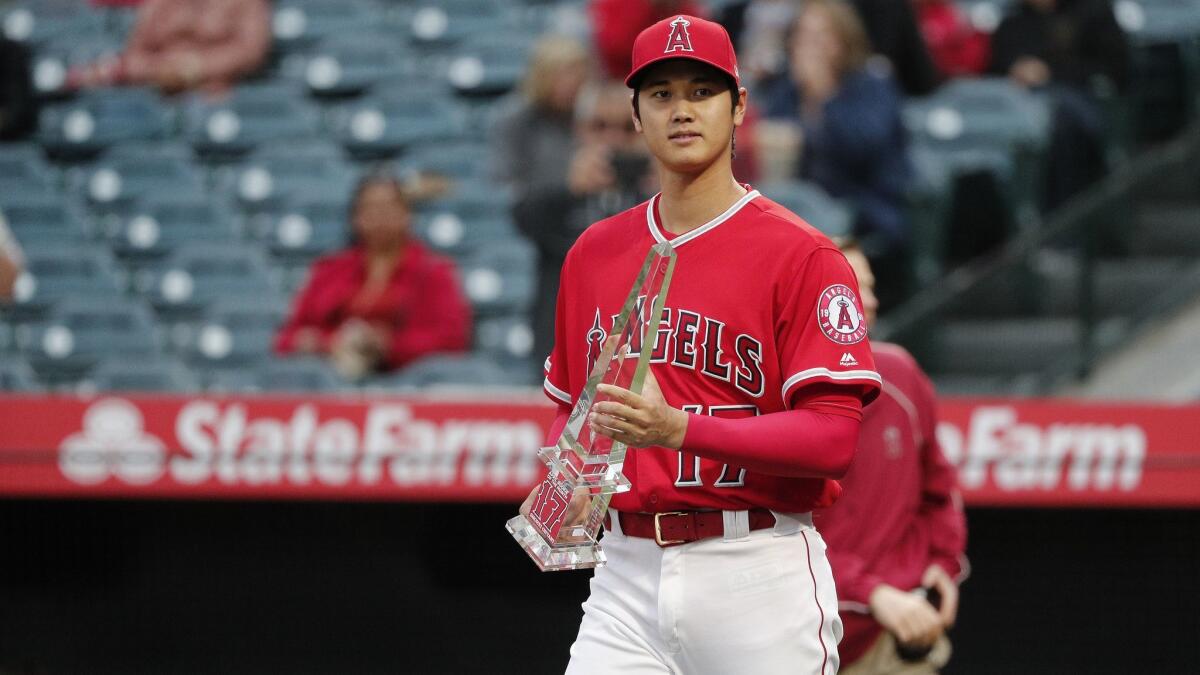 Shohei Ohtani receives the April Rookie of the Month Award before the game against the Minnesota Twins at Angel Stadium.