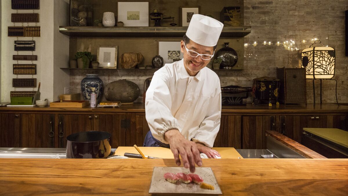 Chef Hiroyuki Naruke, from Tokyo, Japan, preparing a plate of Toro at Q Sushi in downtown Los Angeles.