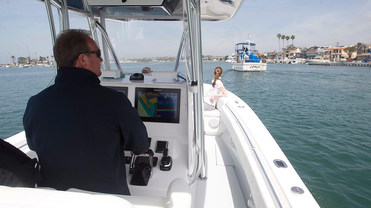 Pete Nolan pilots a boat equipped with a Seakeeper, gyro technology that stabilizes the boat, keeping seasickness and rocking conditions to a minimum.