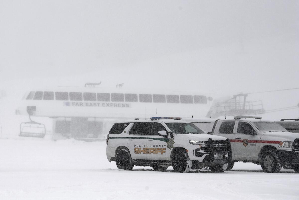 Placer County sheriff vehicles are parked near the ski lift at Palisades Tahoe where avalanche occurred on Jan. 10.