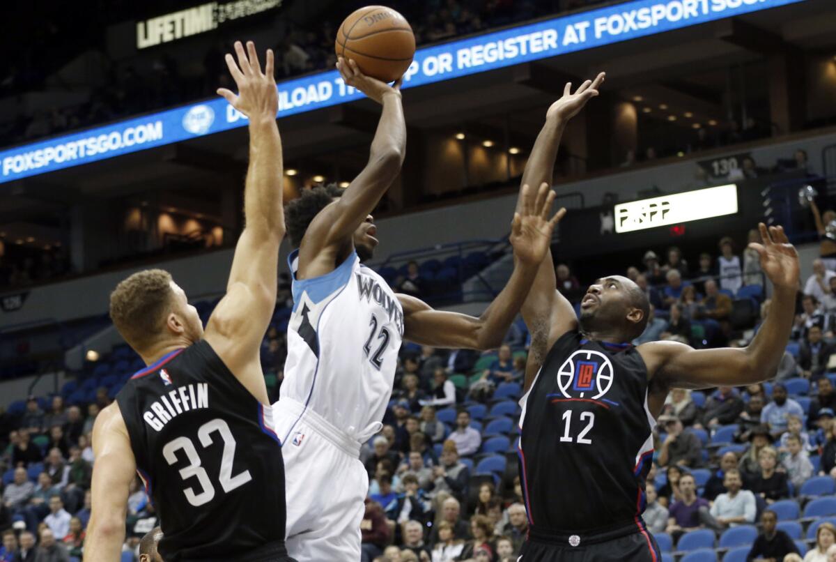 Clippers forward Luc Richard Mbah a Moute tries to block the shot of Timberwolves forward Andrew Wiggins in the first quarter.