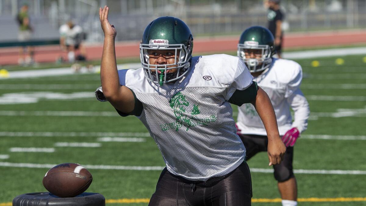 Senior lineman Carlos Aguilar, shown during practice on Aug. 14, and the Costa Mesa High football team are seeking their first win of 2018.