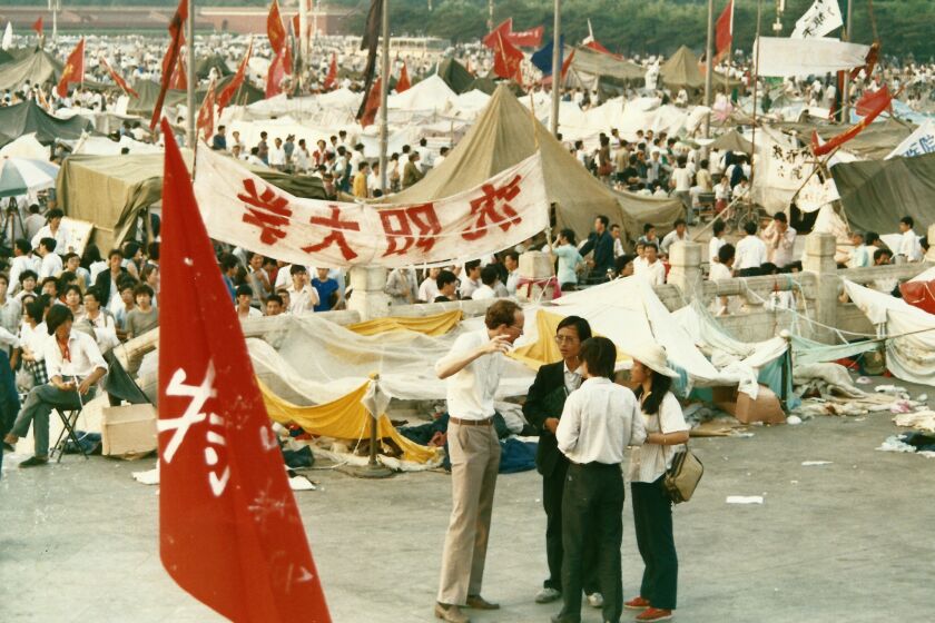 Reporter David Holley shown interviewing people in Tiananmen Square during the seven weeks of protest.