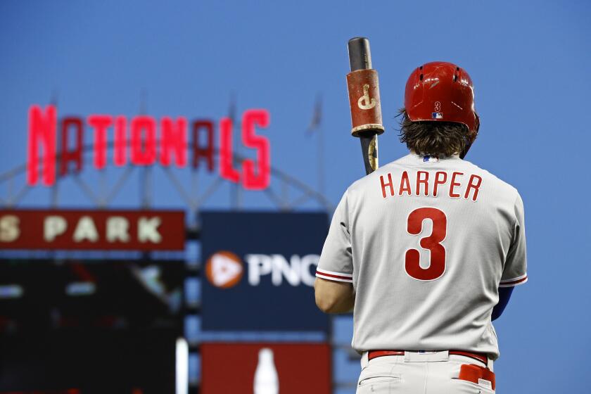 Philadelphia Phillies' Bryce Harper prepares for an at-bat during a baseball game against the Washington Nationals, Wednesday, Sept. 25, 2019, in Washington. (AP Photo/Patrick Semansky)