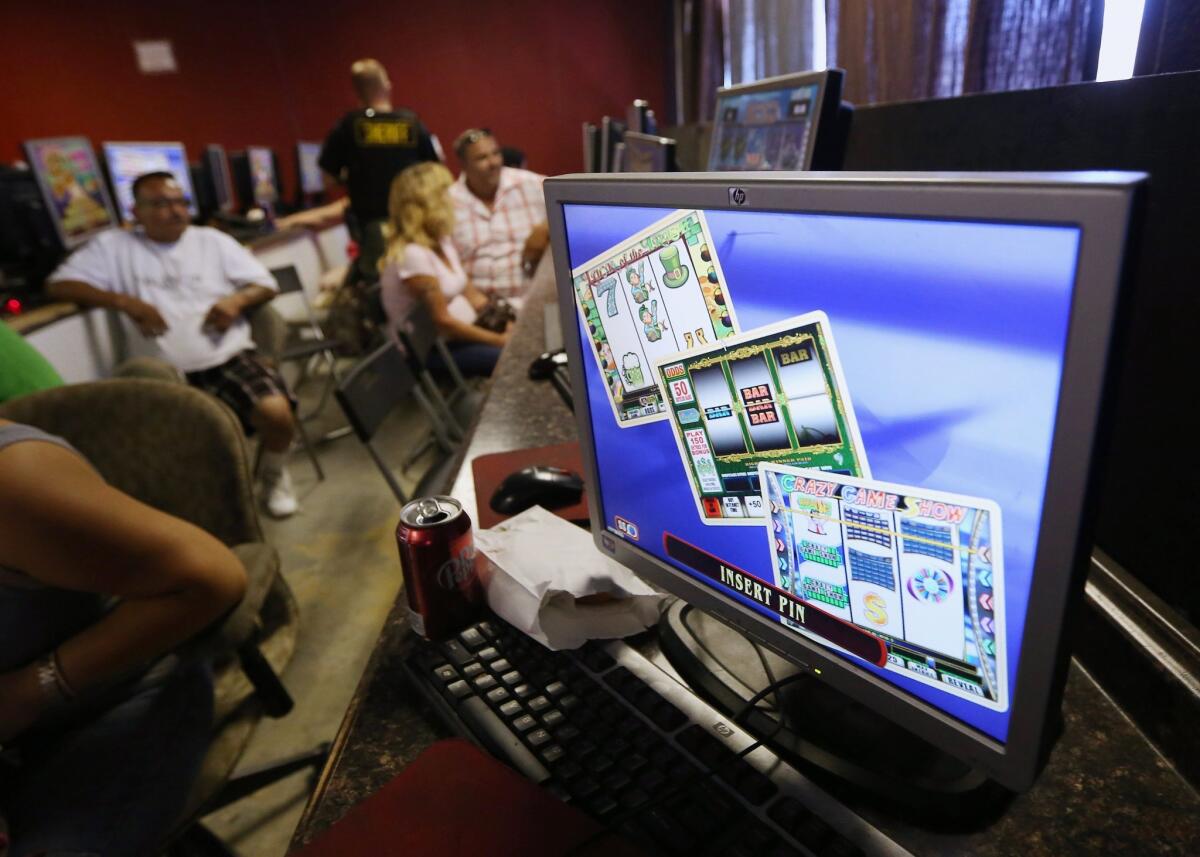 The California Supreme Court ruled that "sweepstakes" games found inside Internet cafes are illegal slot machines. Pictured above, "sweepstakes" games are displayed on a computer screen at a bar in Sacramento.