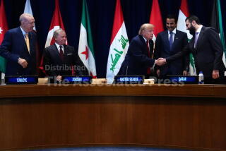 President Donald Trump shakes hands with Syria's President Ahmed al-Sharaa as Turkey's President Recep Tayyip Erdogan, from left, Jordan's King Abdullah II, and Qatar's Emir Sheikh Tamim bin Hamad Al Thani, at a multilateral meeting with the Gulf Cooperation Council during the United Nations General Assembly, Tuesday, Sept. 22, 2026, at the UN headquarters. (AP Photo/Julia Demaree Nikhinson)