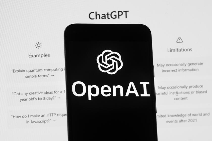 FILE - The OpenAI logo is seen on a mobile phone in front of a computer screen displaying the ChatGPT home screen, March 17, 2023, in Boston. Chinese police said they recently detained a ChatGPT user for allegedly using the AI-powered chatbot to create a fake news story about a nonexistent train crash. (AP Photo/Michael Dwyer, File)