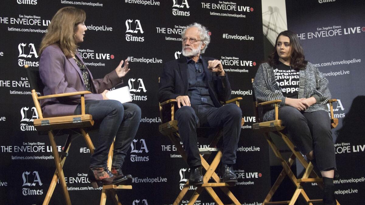 Director Markus Imhoof, center, in a Q&A for his movie "Eldorado" with Times critic Lorraine Ali, left, and Muna Sharif of Amnesty International, right, at the LA Times Envelope Live screening at the Montalbán.