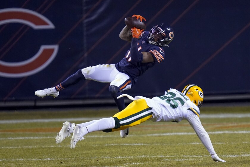 Chicago Bears' Darnell Mooney catches a pass in front of Green Bay Packers' Darnell Savage during the second half of an NFL football game Sunday, Jan. 3, 2021, in Chicago. (AP Photo/Charles Rex Arbogast)
